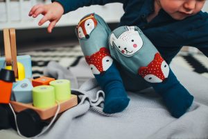 Think like a curious child. If toys or interesting items are in sight, there can be temptation to crawl or climb to retrieve them. -Image via Pexels